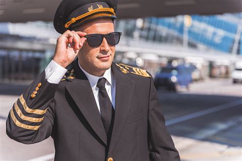 A pilot with cool sunglasses .